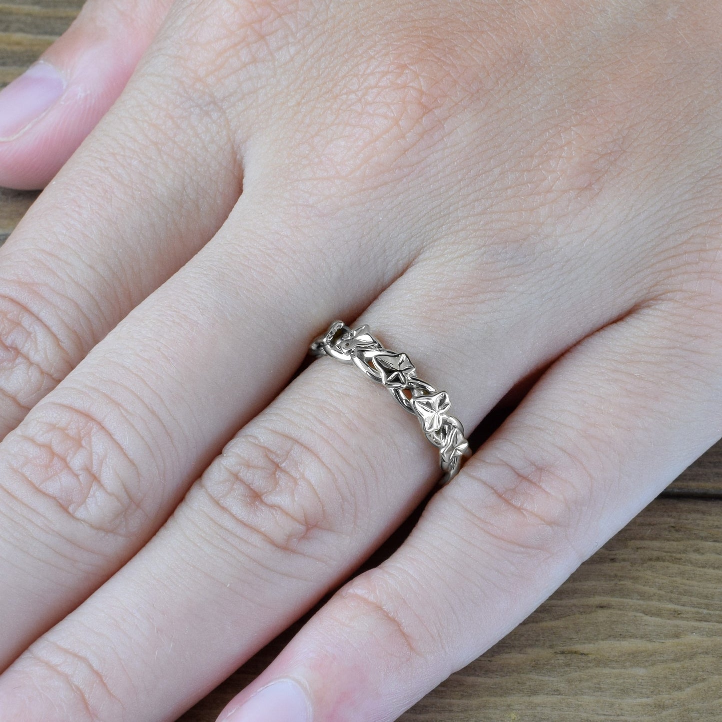 ivy leaves and vines ring in white gold on finger
