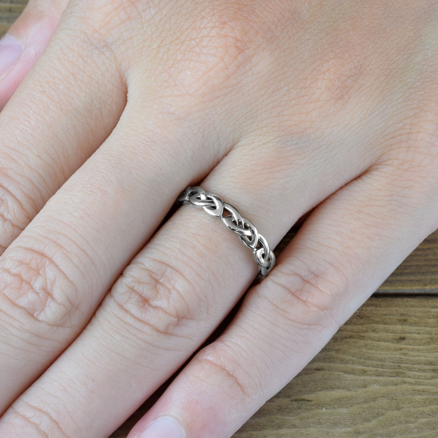 love knot ring in white gold on finger