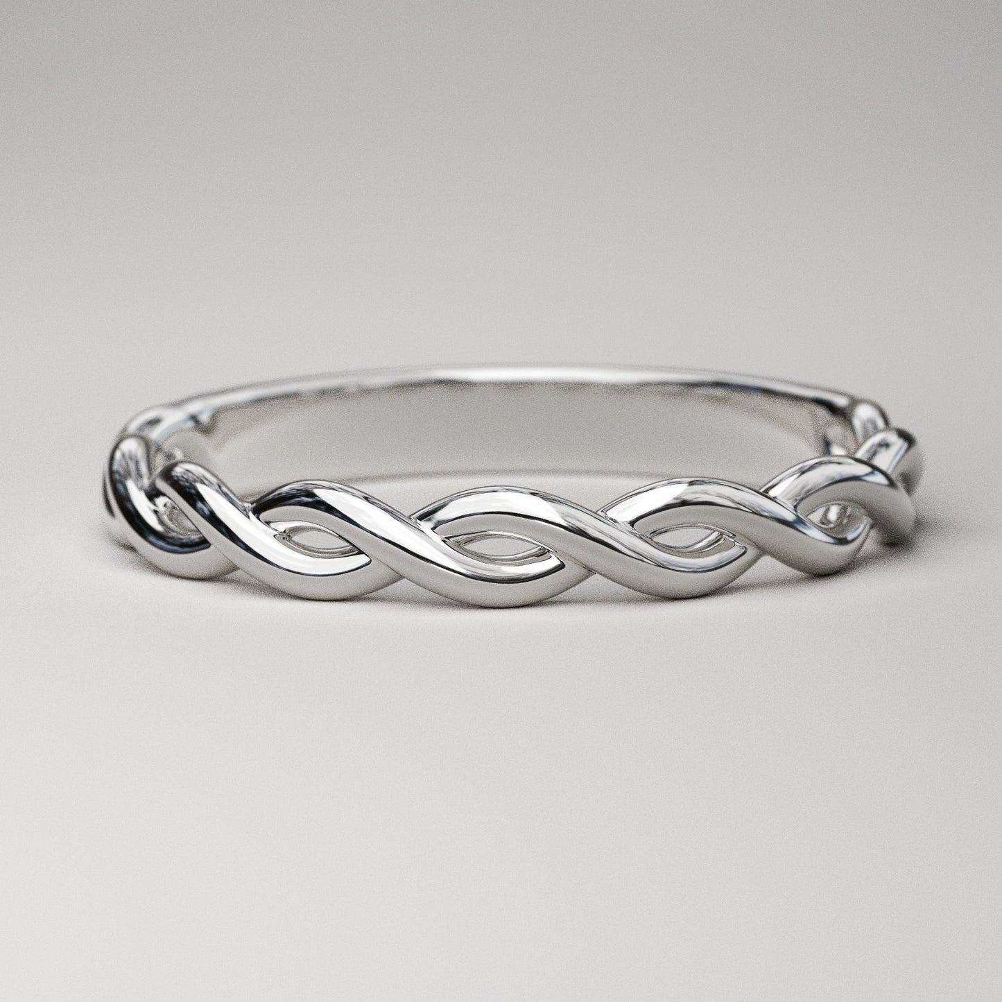 woven gold band in white gold by Pete Rhodes