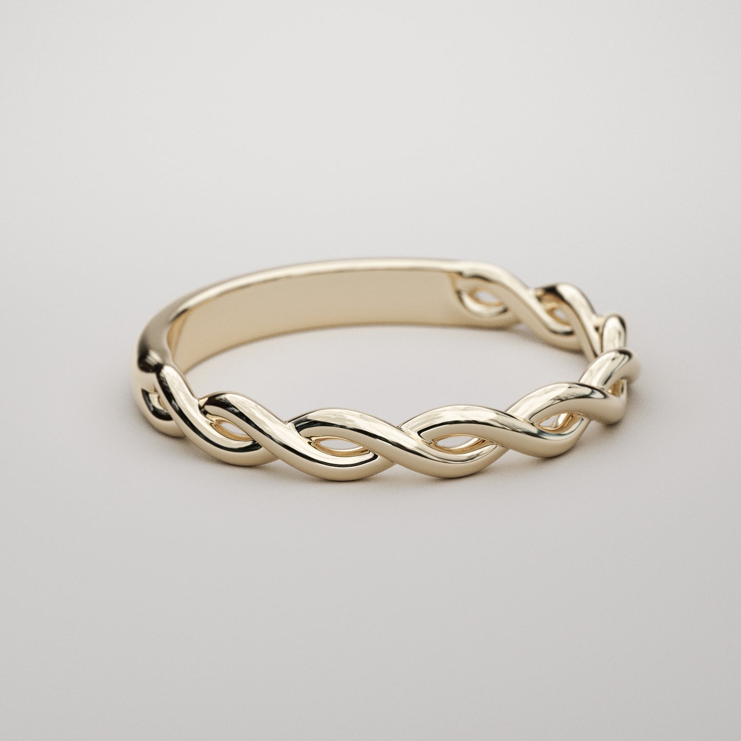 woven gold band in yellow gold by Pete Rhodes