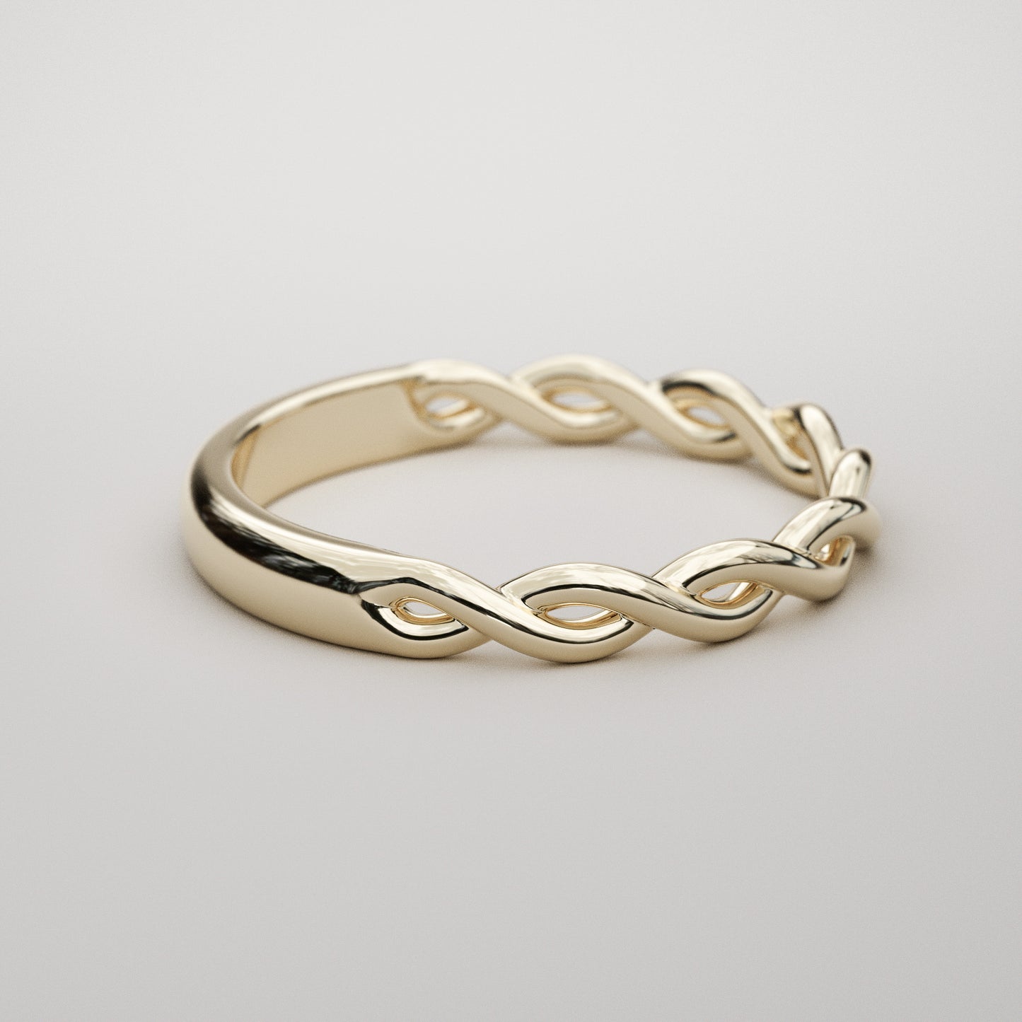 woven gold band in yellow gold by Pete Rhodes