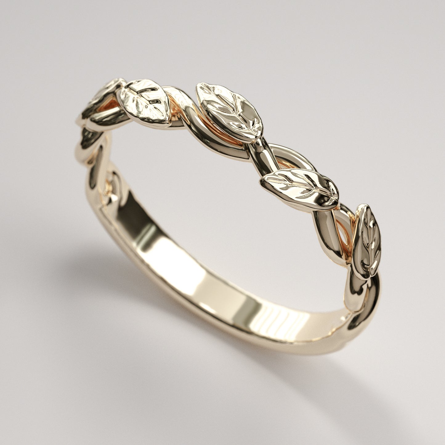 intertwined vine ring with leaves in yellow gold