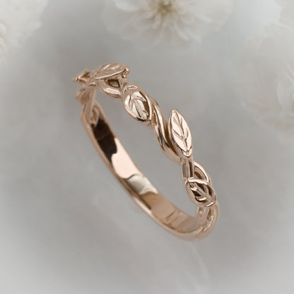 intertwined vine ring with leaves in solid rose gold oblique view