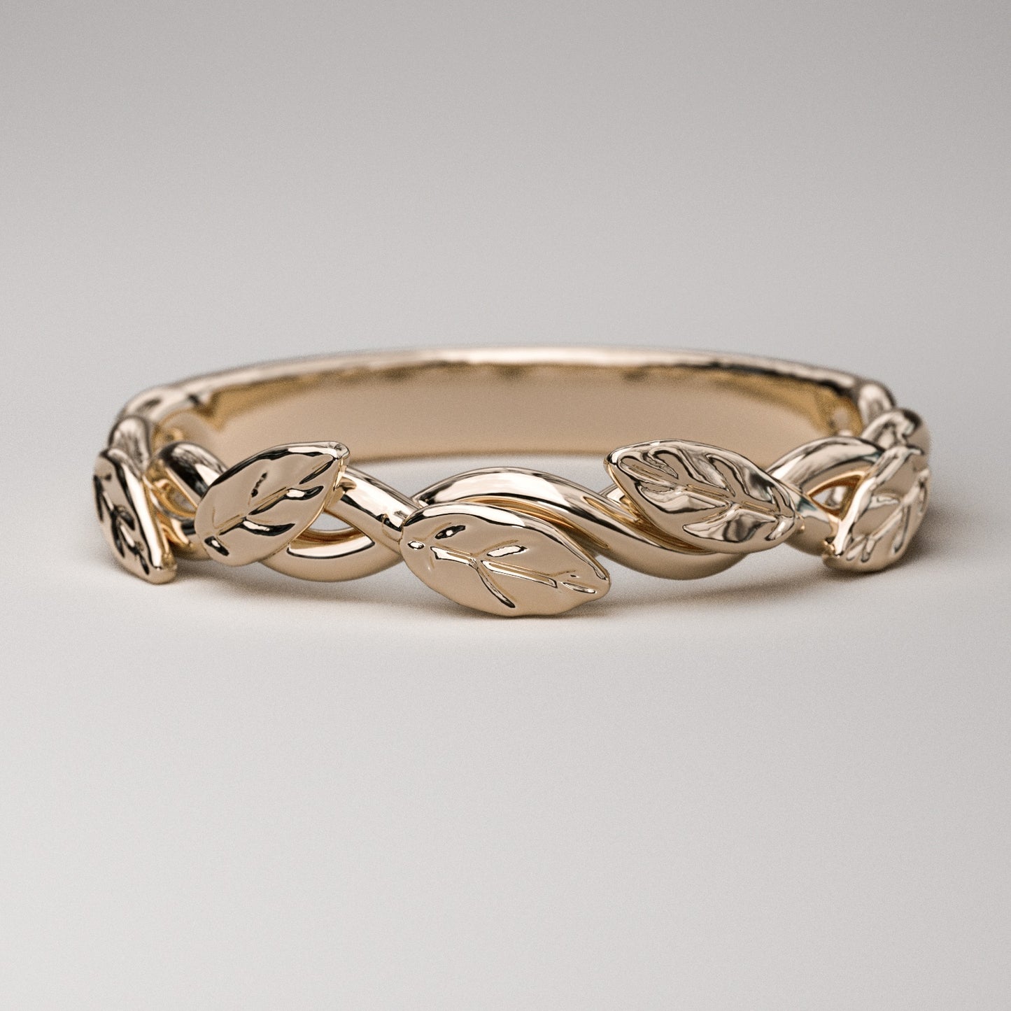 intertwined vine ring with leaves in solid rose gold