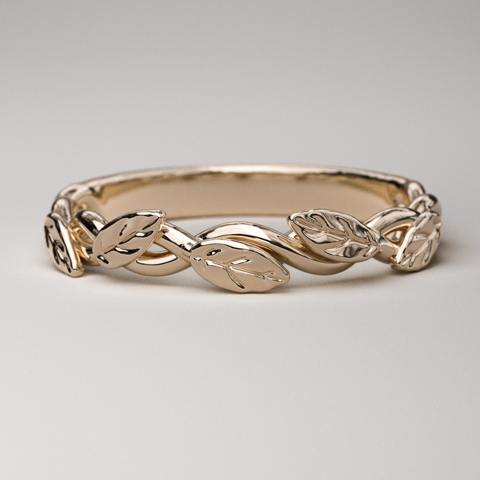 intertwined vine ring with leaves in solid rose gold