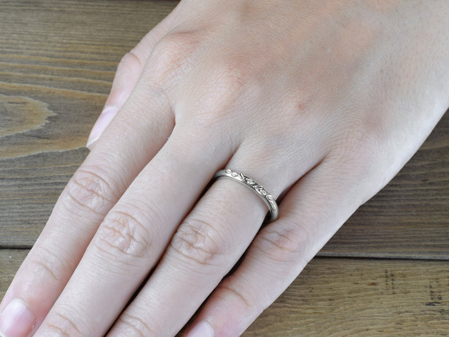 Antique inspired leaves and diamond domed ring in 14k or 18k white gold on finger