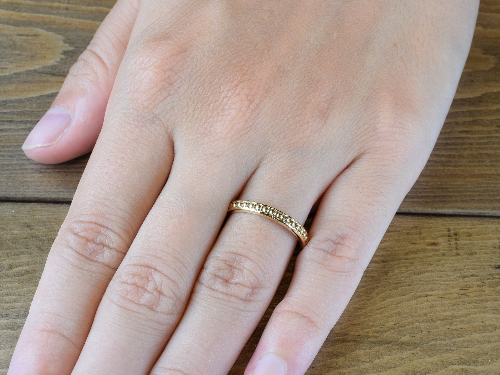 2.5mm wide yellow gold bead wedding band on hand