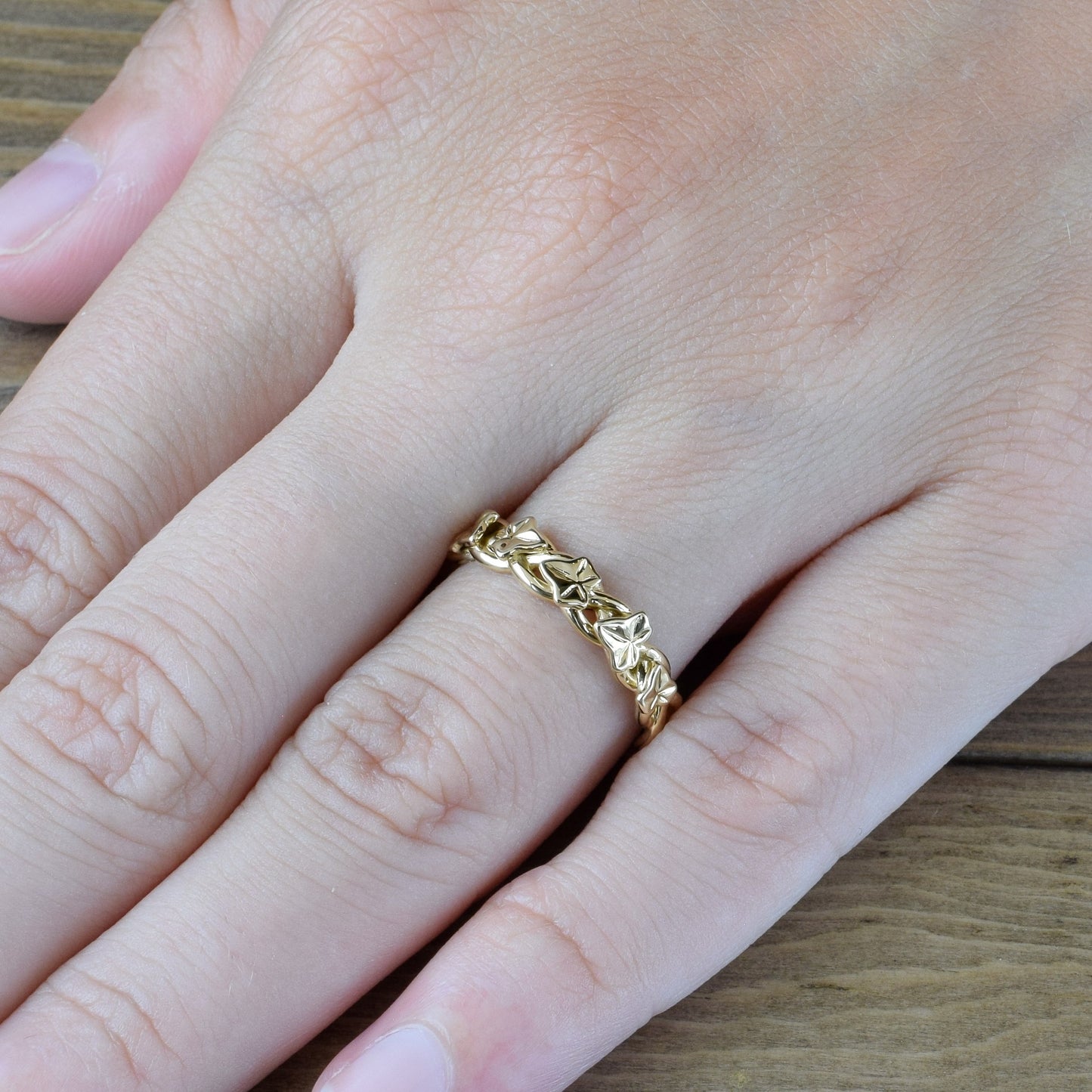 ivy leaves and vines ring in yellow gold on finger