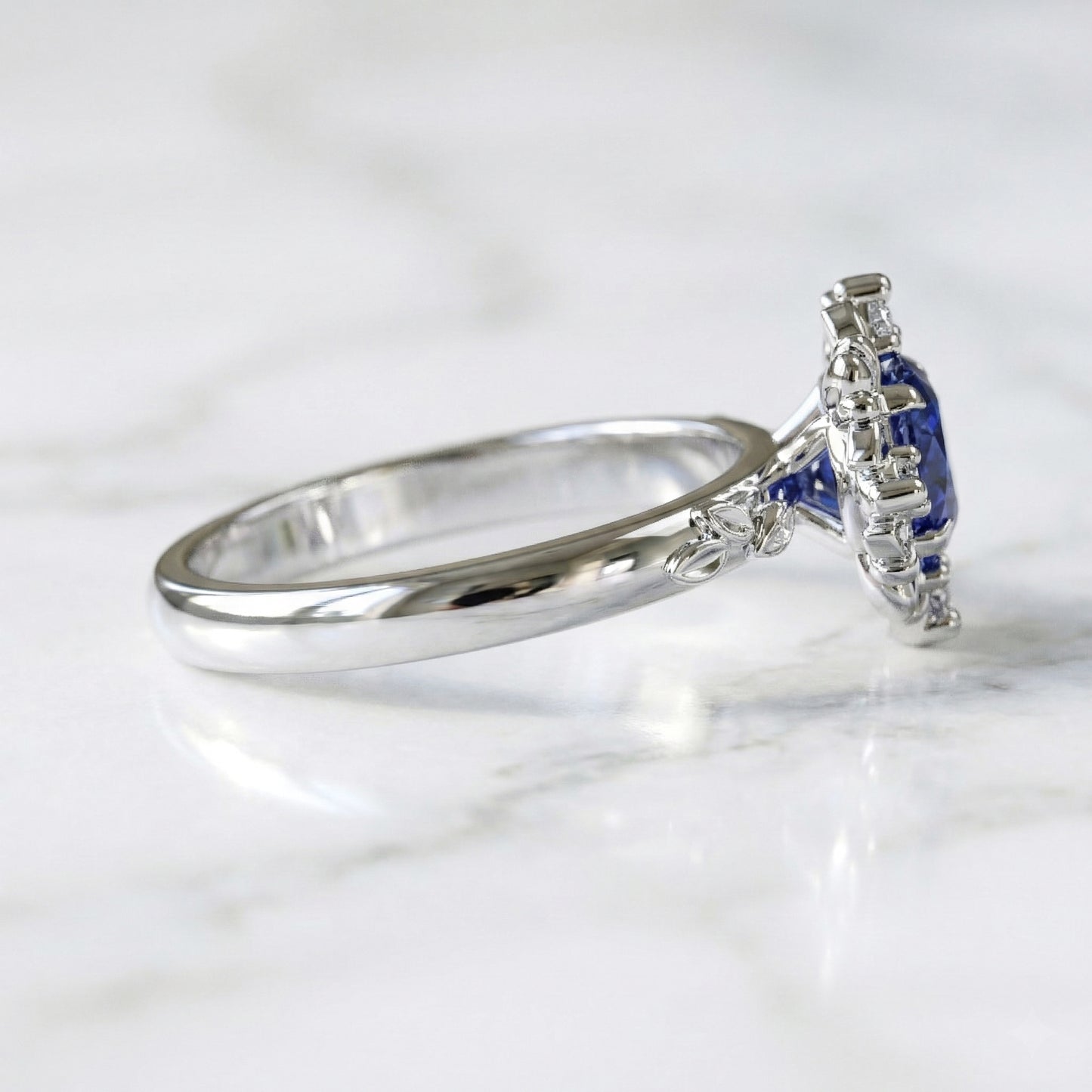 White gold ring with blue sapphire and diamond accents 