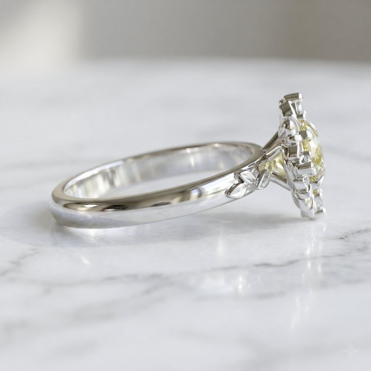 white gold ring with light yellow sapphire