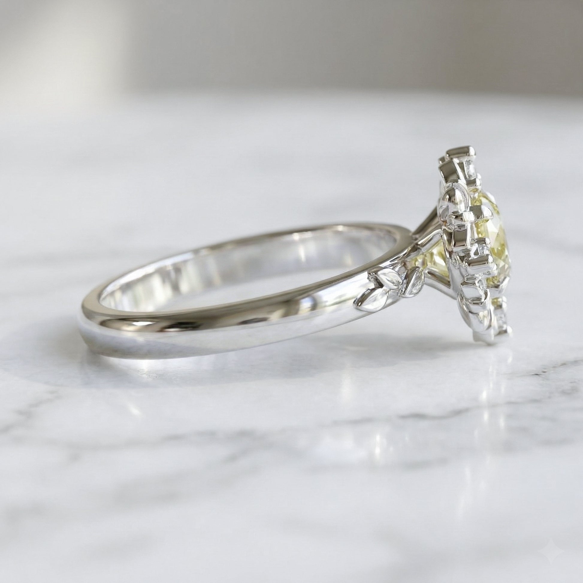 white gold ring with light yellow sapphire