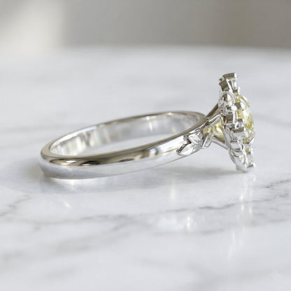 white gold ring with light yellow sapphire