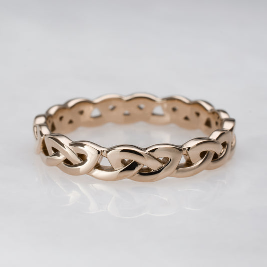 Unique 14k rose gold wedding band - simple knot Celtic eternity ring