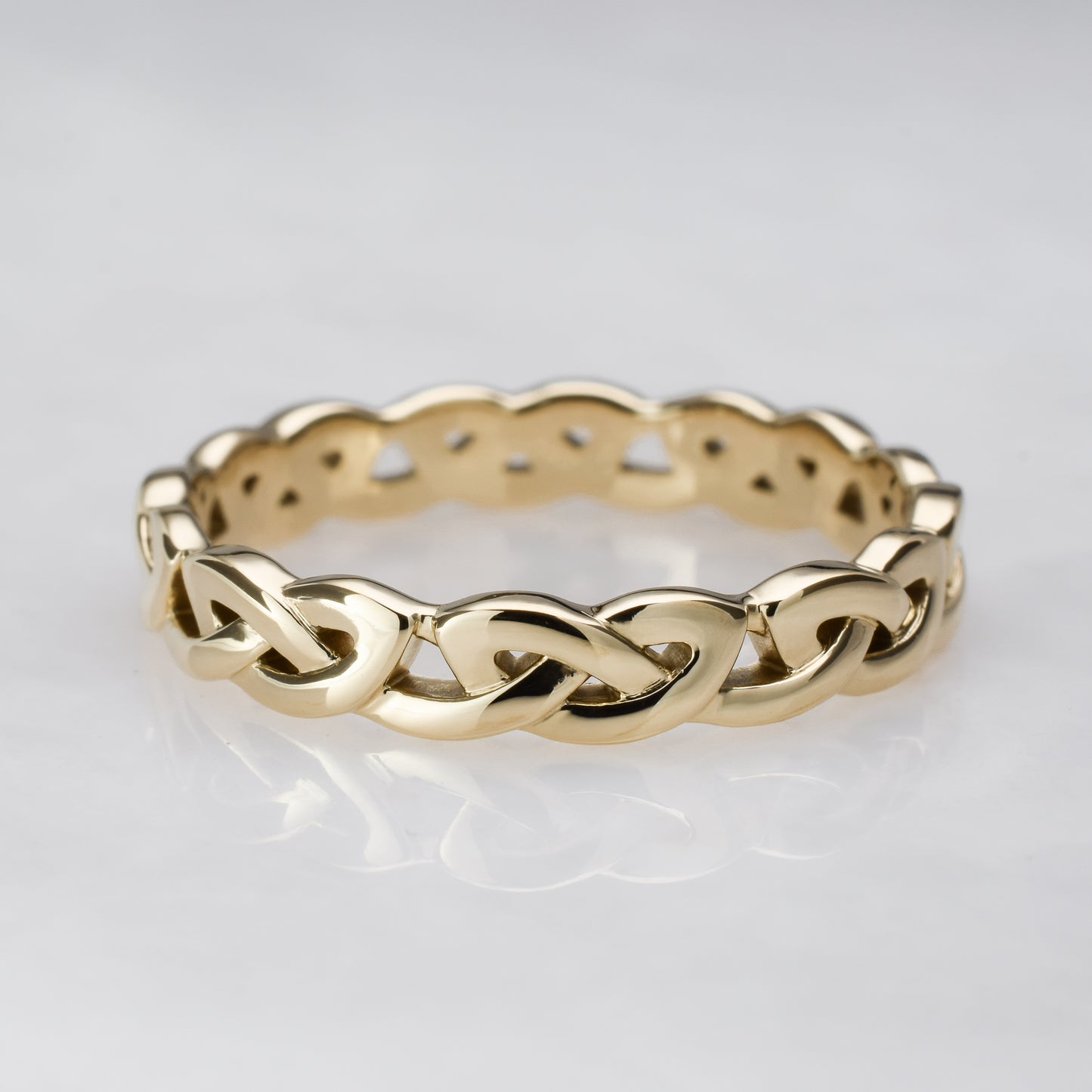 Overhand knot gold eternity band 