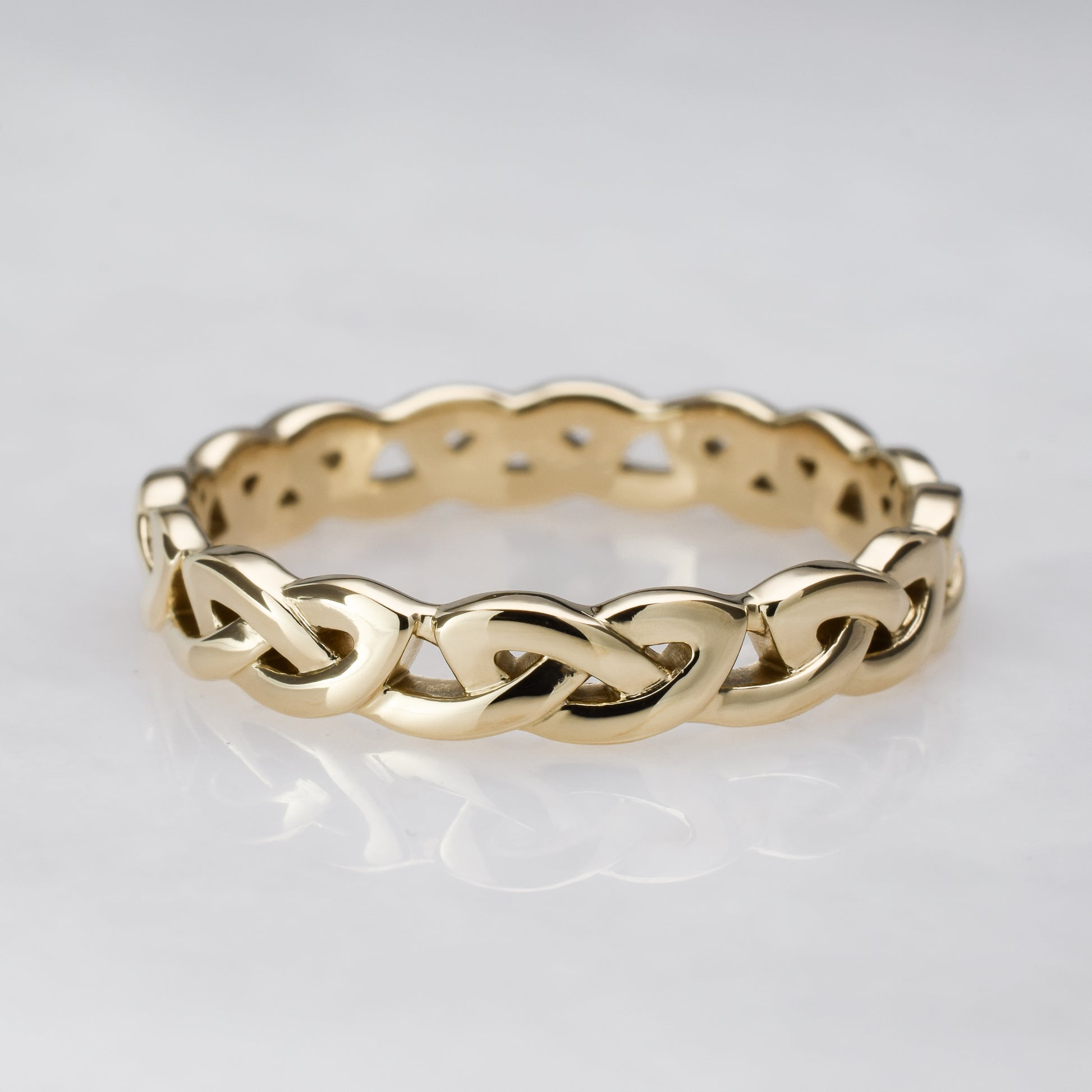 Overhand knot gold eternity band 