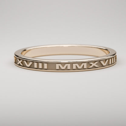 Custom date ring in 14k rose gold featuring your date in Roman Numerals
