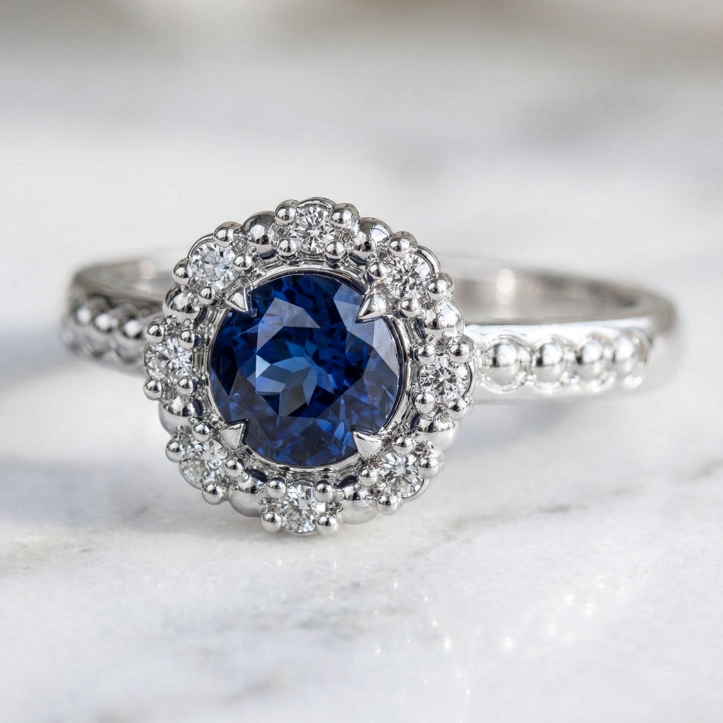 Antique inspired Blue sapphire ring in white gold