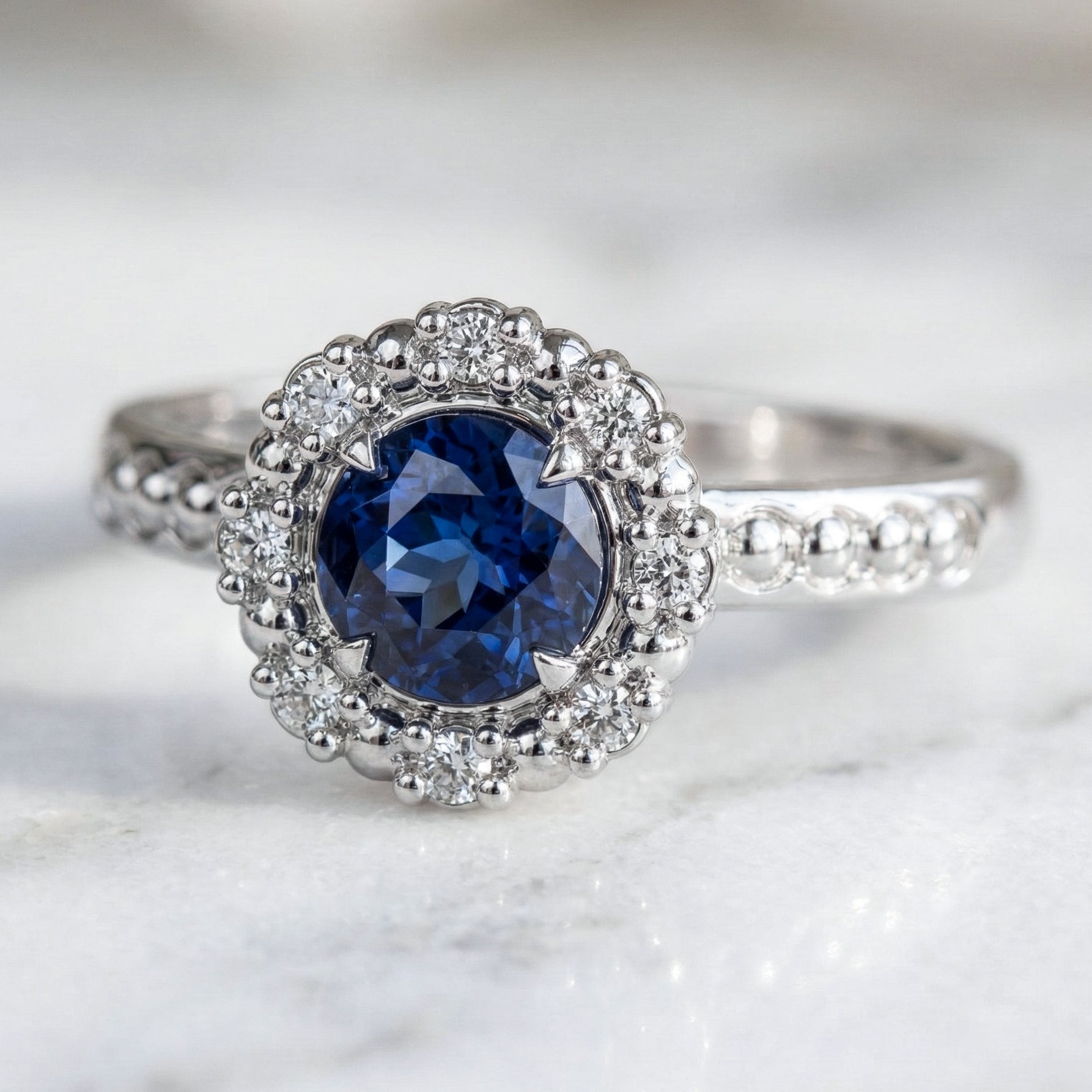 Antique inspired Blue sapphire ring in white gold