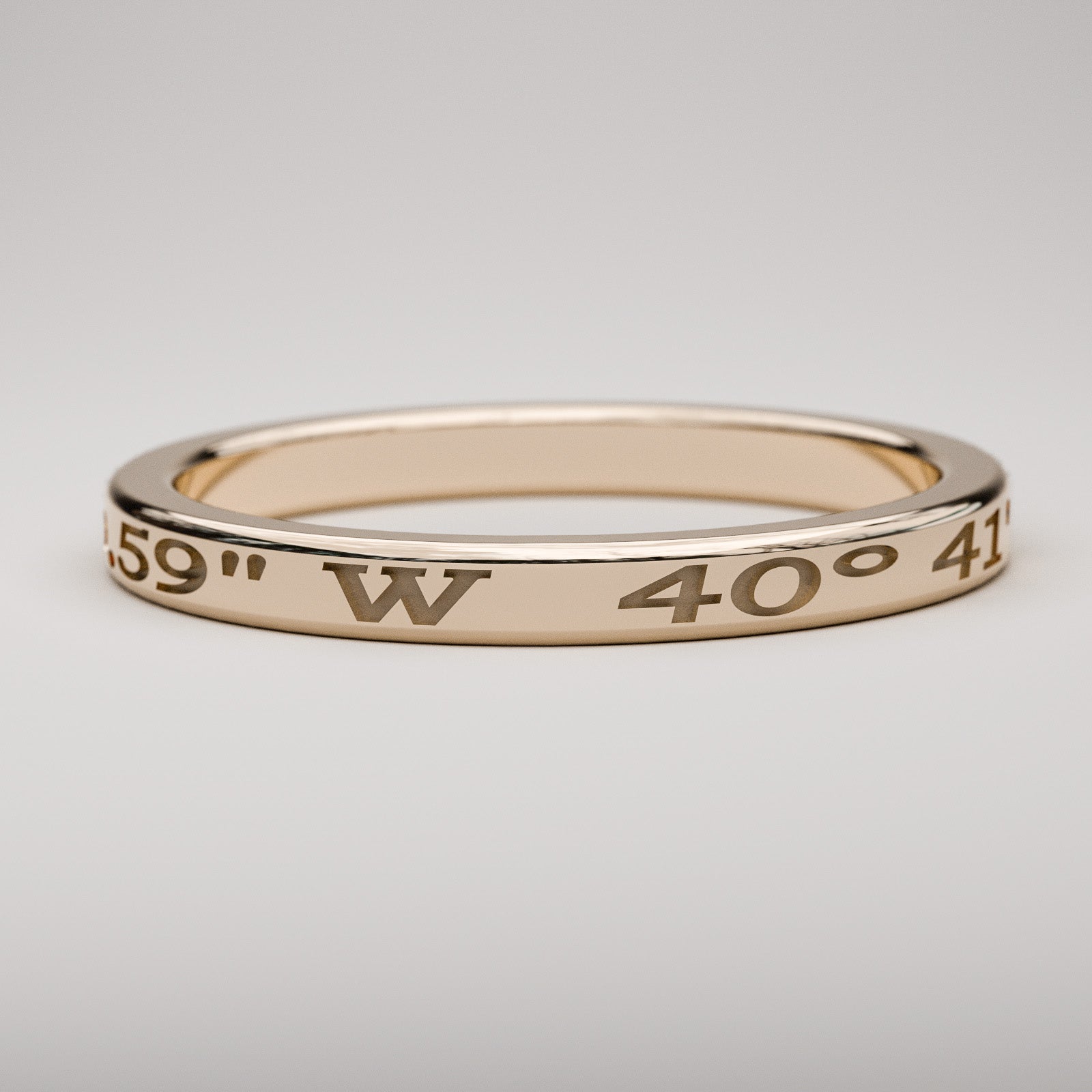 narrow custom engraved coordinates ring in rose gold