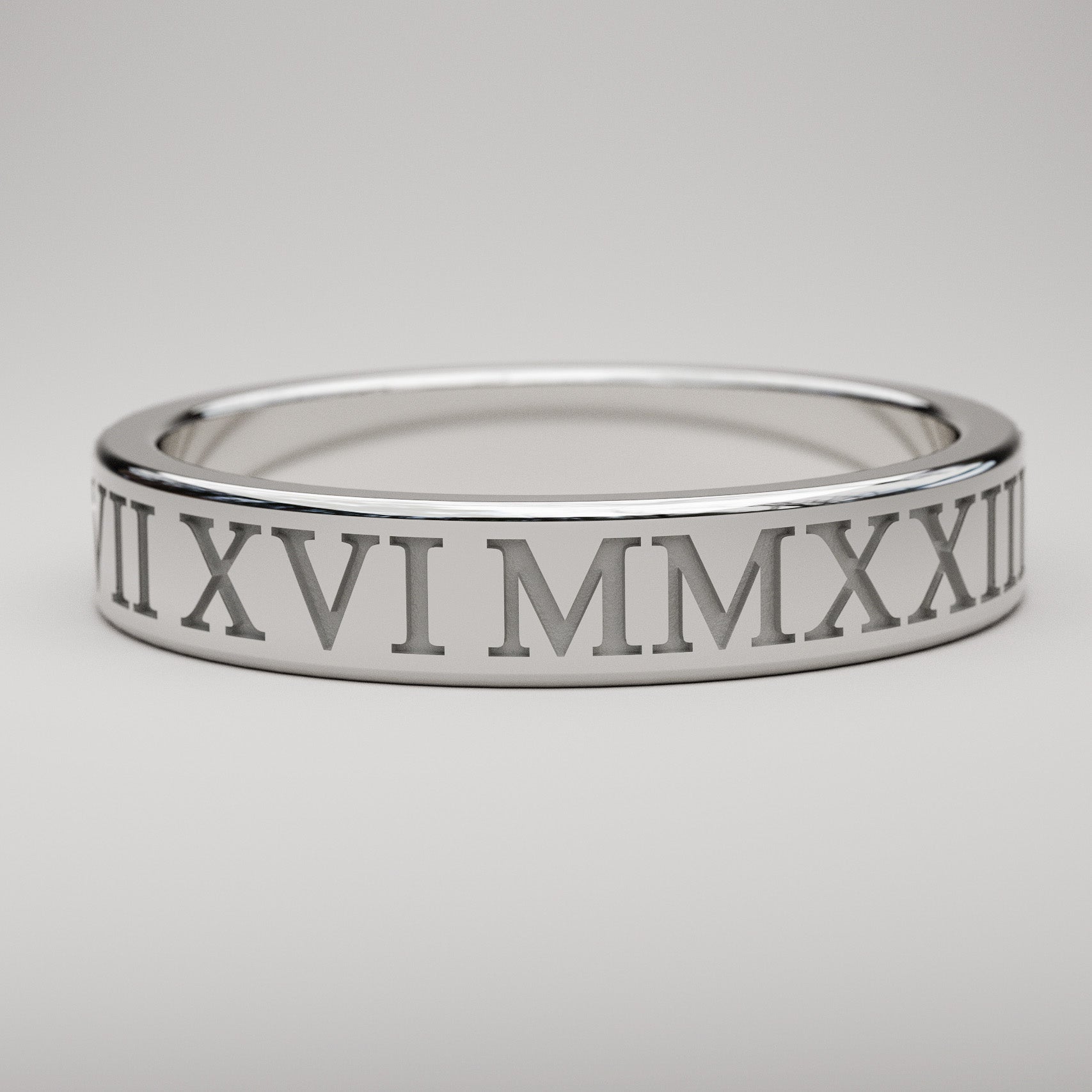 inset custom date Roman Numeral ring in white gold, 4mm wide
