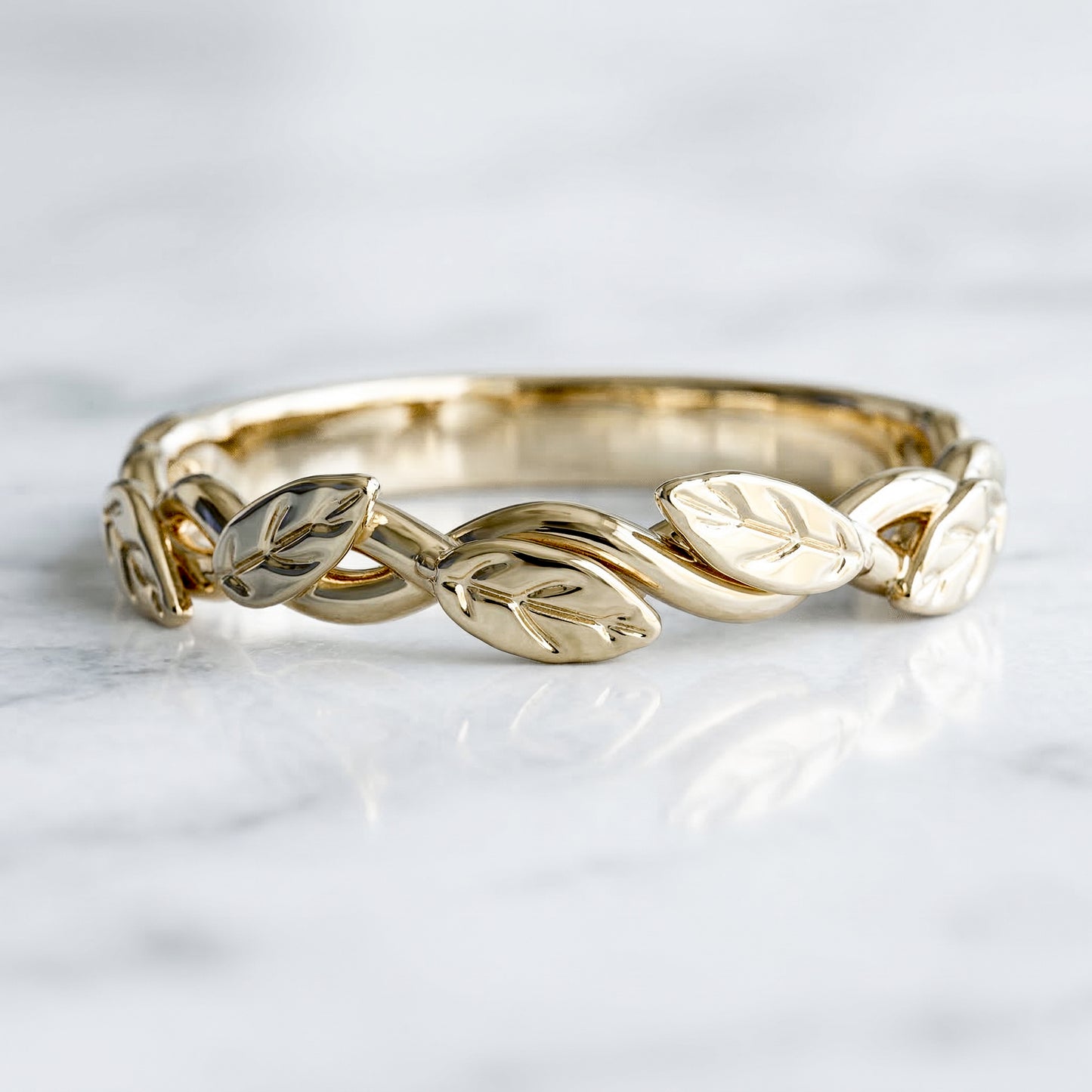 Gold band with leaf designs 