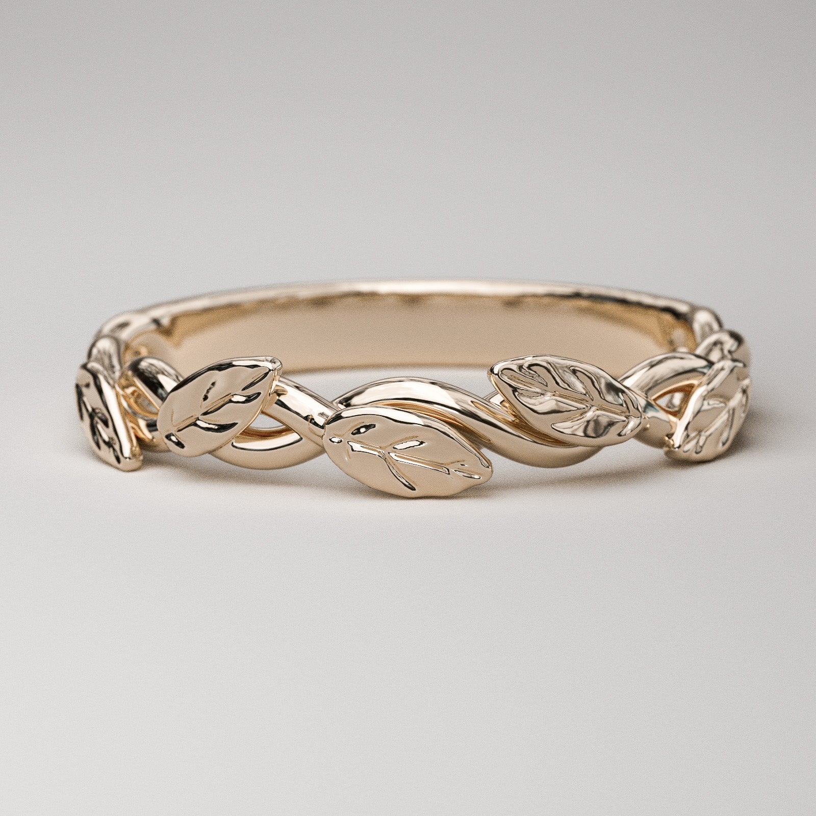intertwined vine ring with leaves in rose gold
