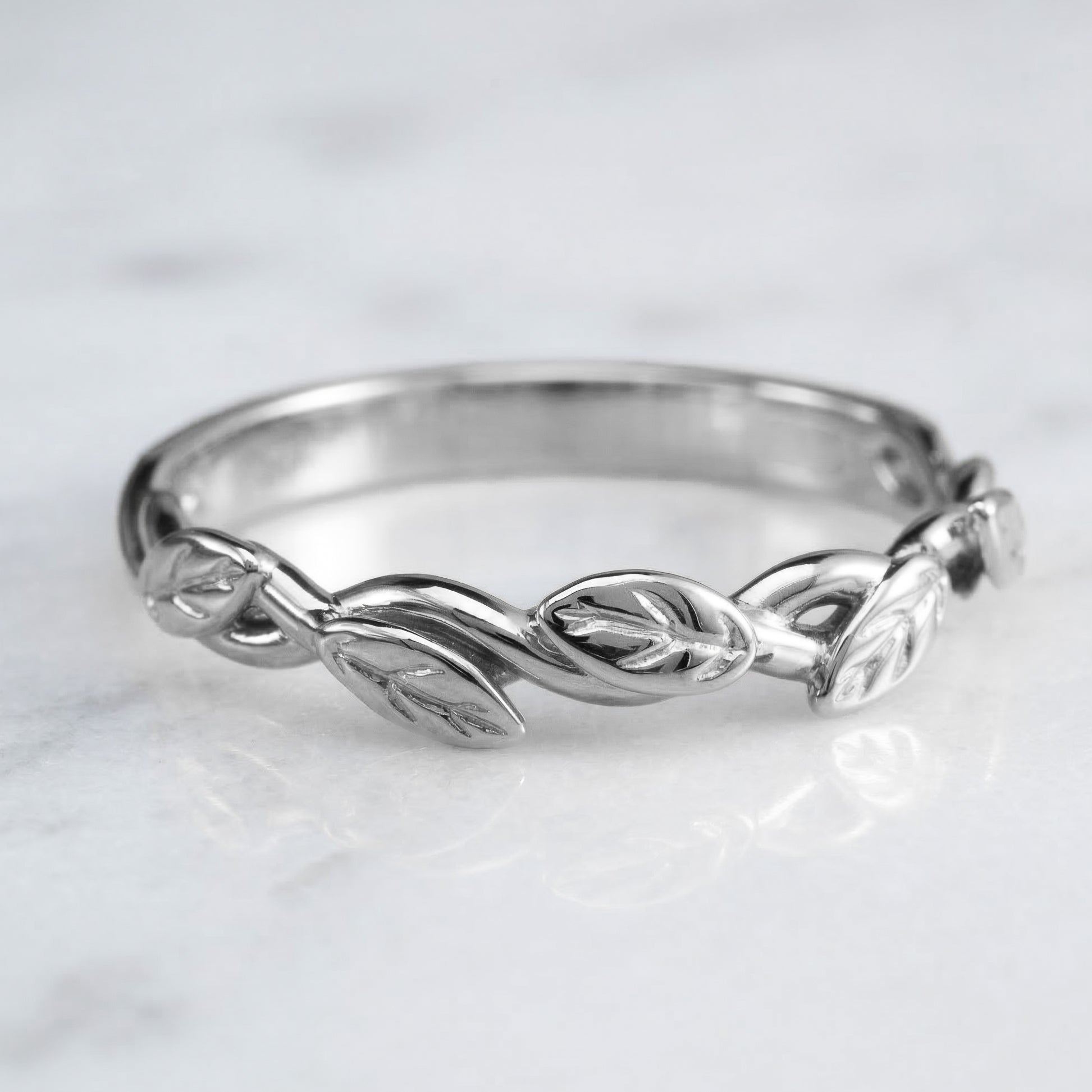 white gold ring with leaf design