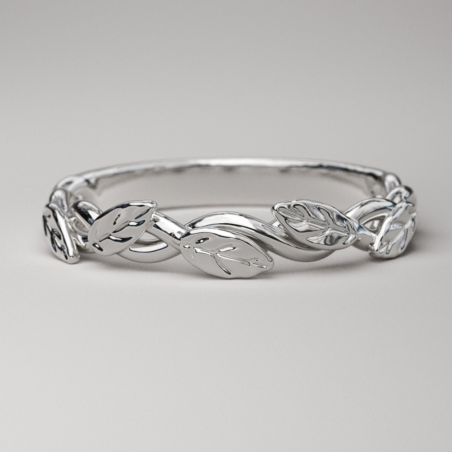 intertwined vine ring with leaves in white gold