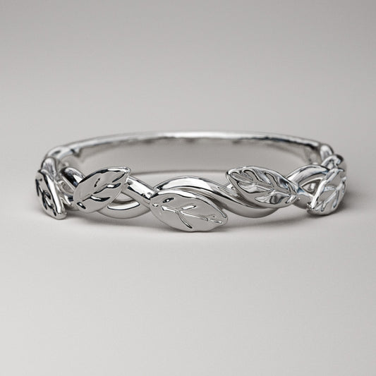 intertwined vine ring with leaves in solid white gold