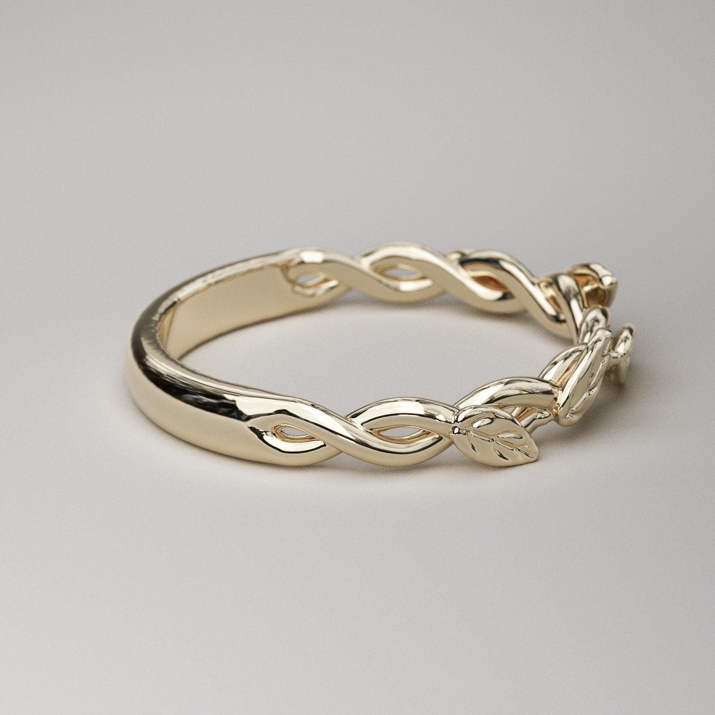intertwined vine ring with leaves in yellow gold