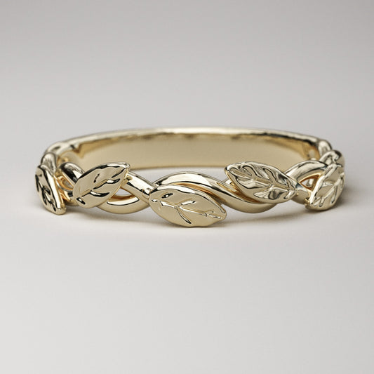intertwined vine ring with leaves in solid yellow gold