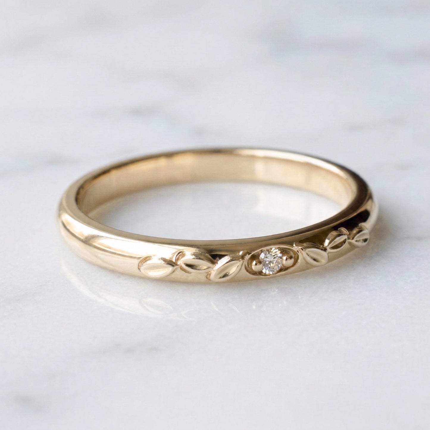 Classic domed gold band with genuine diamond and leaf details