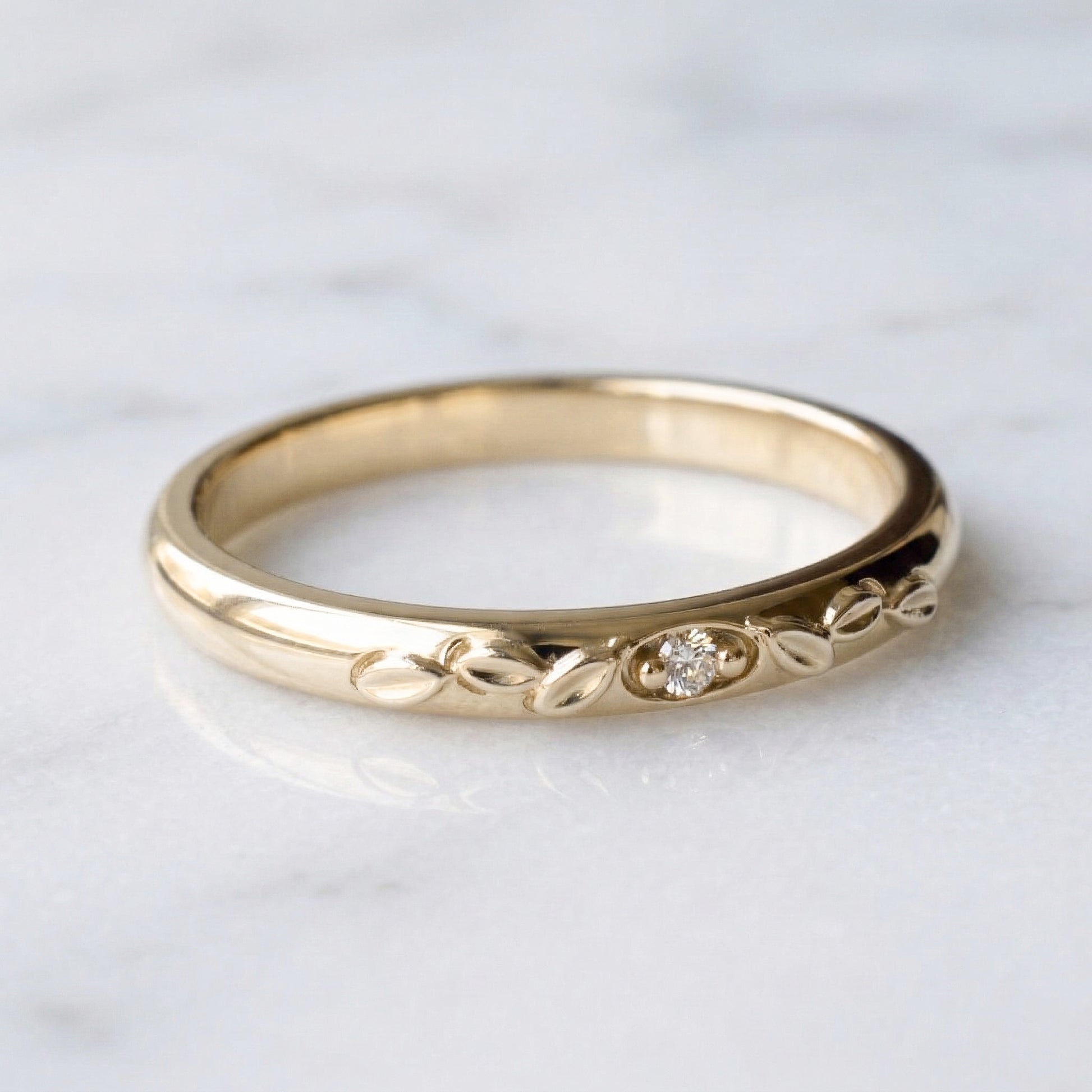 Classic domed gold band with genuine diamond and leaf details