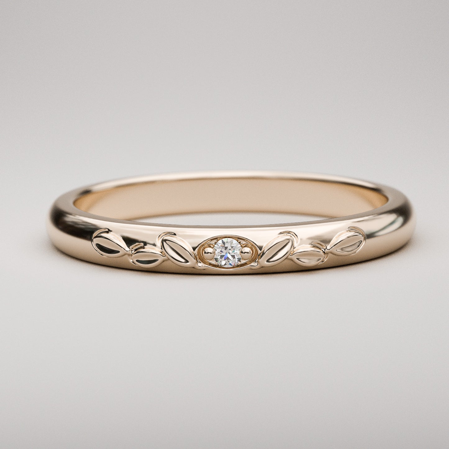 vintage inspired wedding band with leaves and small diamond in rose gold