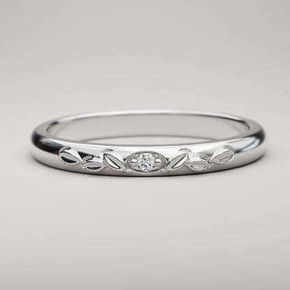 vintage inspired wedding band with leaves and small diamond in white gold