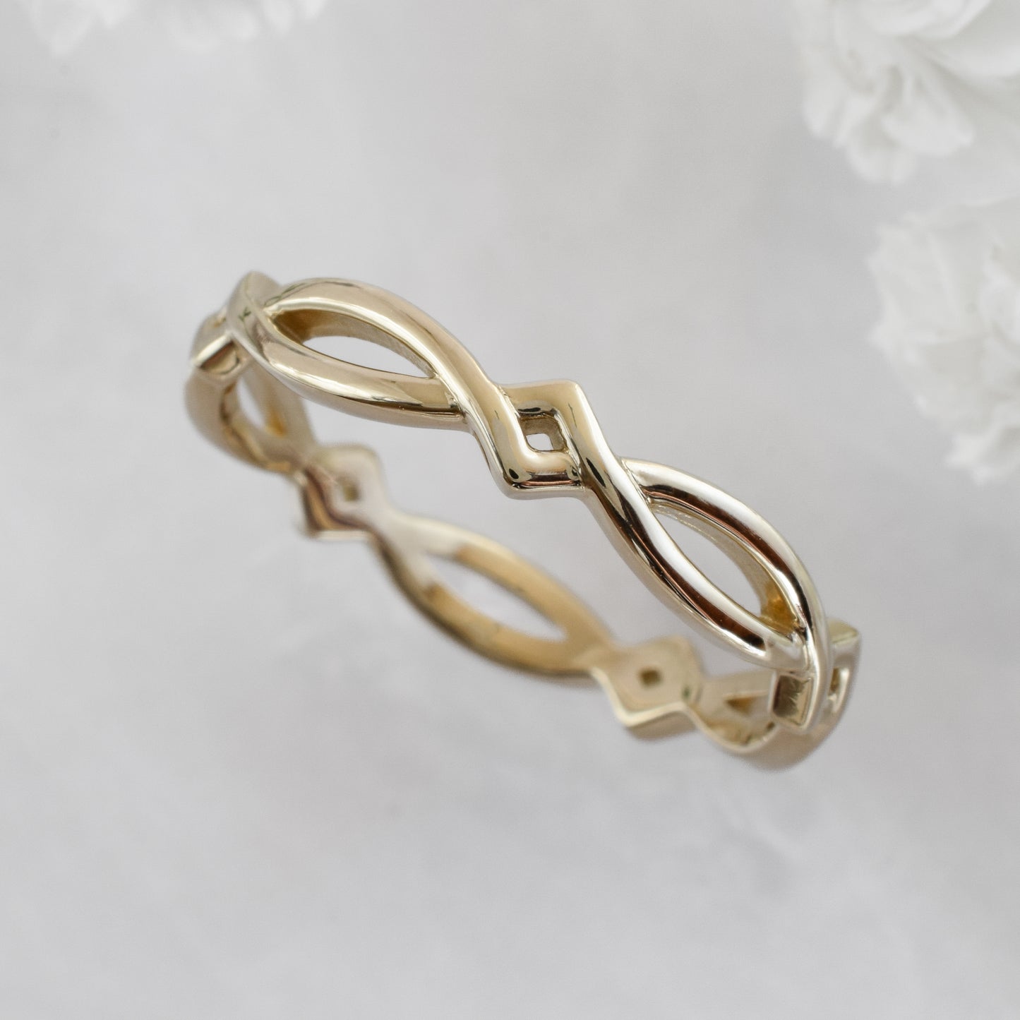 cross over eternity band in gold
