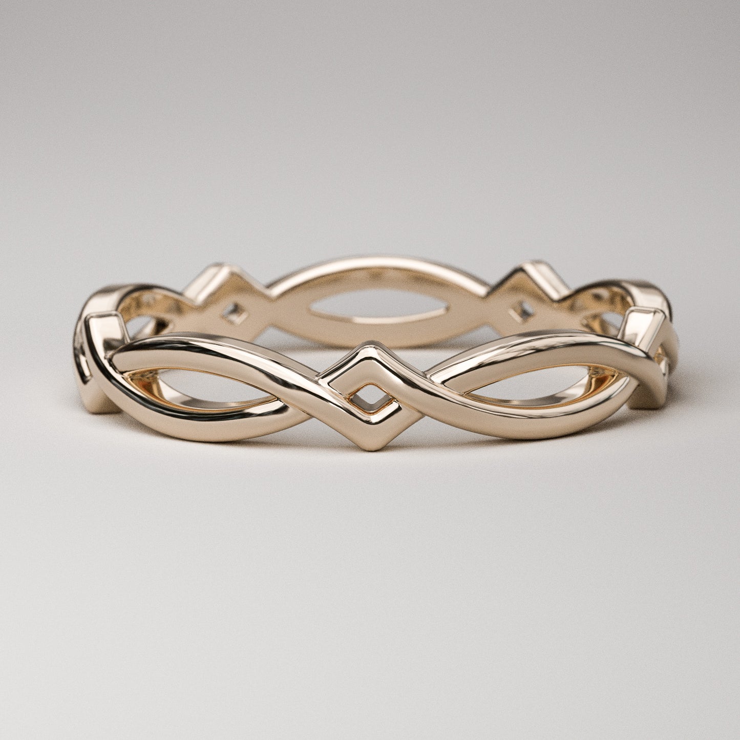 Simple Celtic weave band in solid 14k rose gold by Pete Rhodes