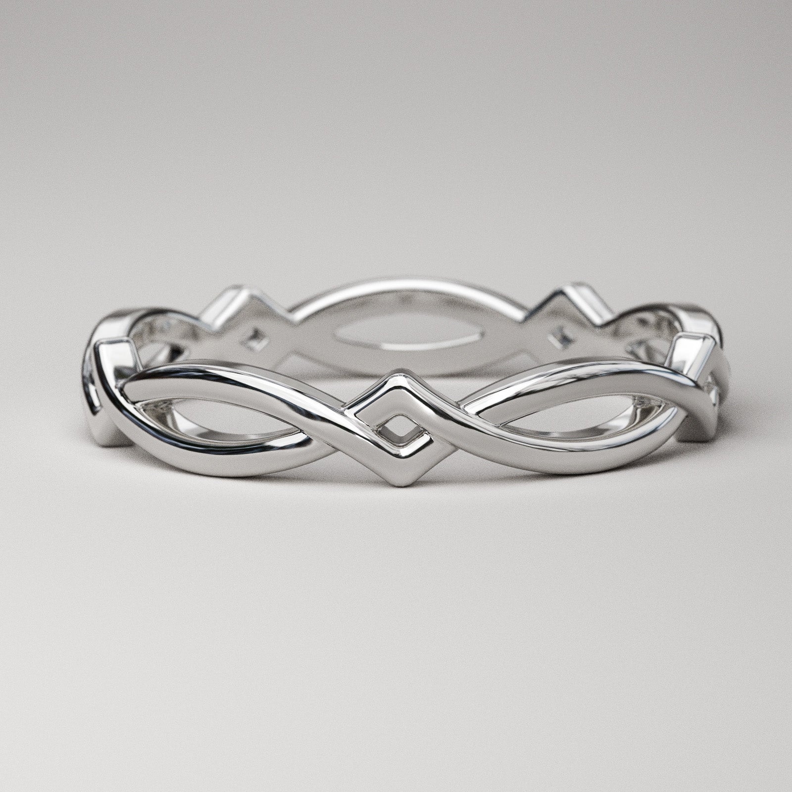 Simple Celtic weave band in solid 14k or 18k white gold by Pete Rhodes