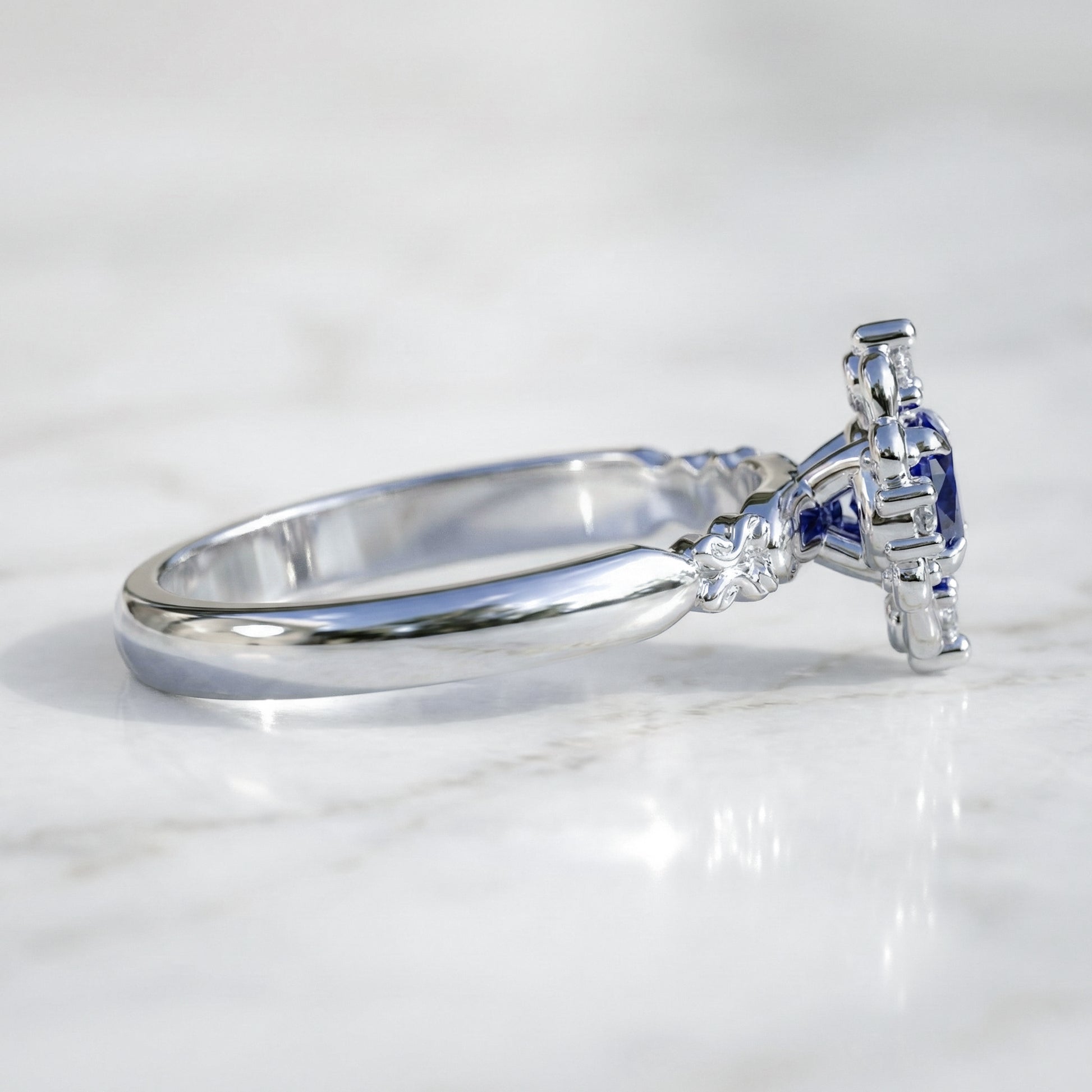 vintage style engagement ring with blue sapphire side view