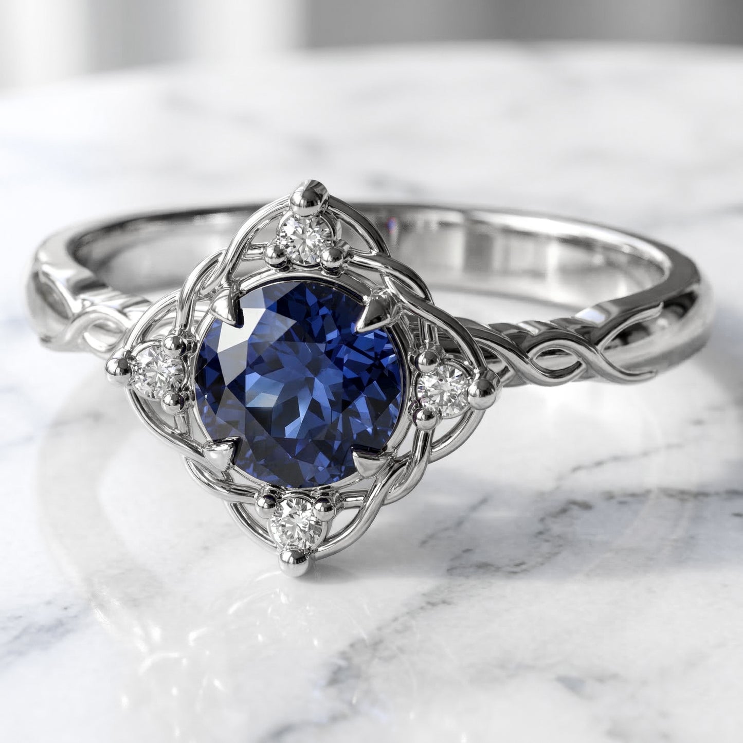 Filigree and diamond halo set medium blue sapphire in white gold settting