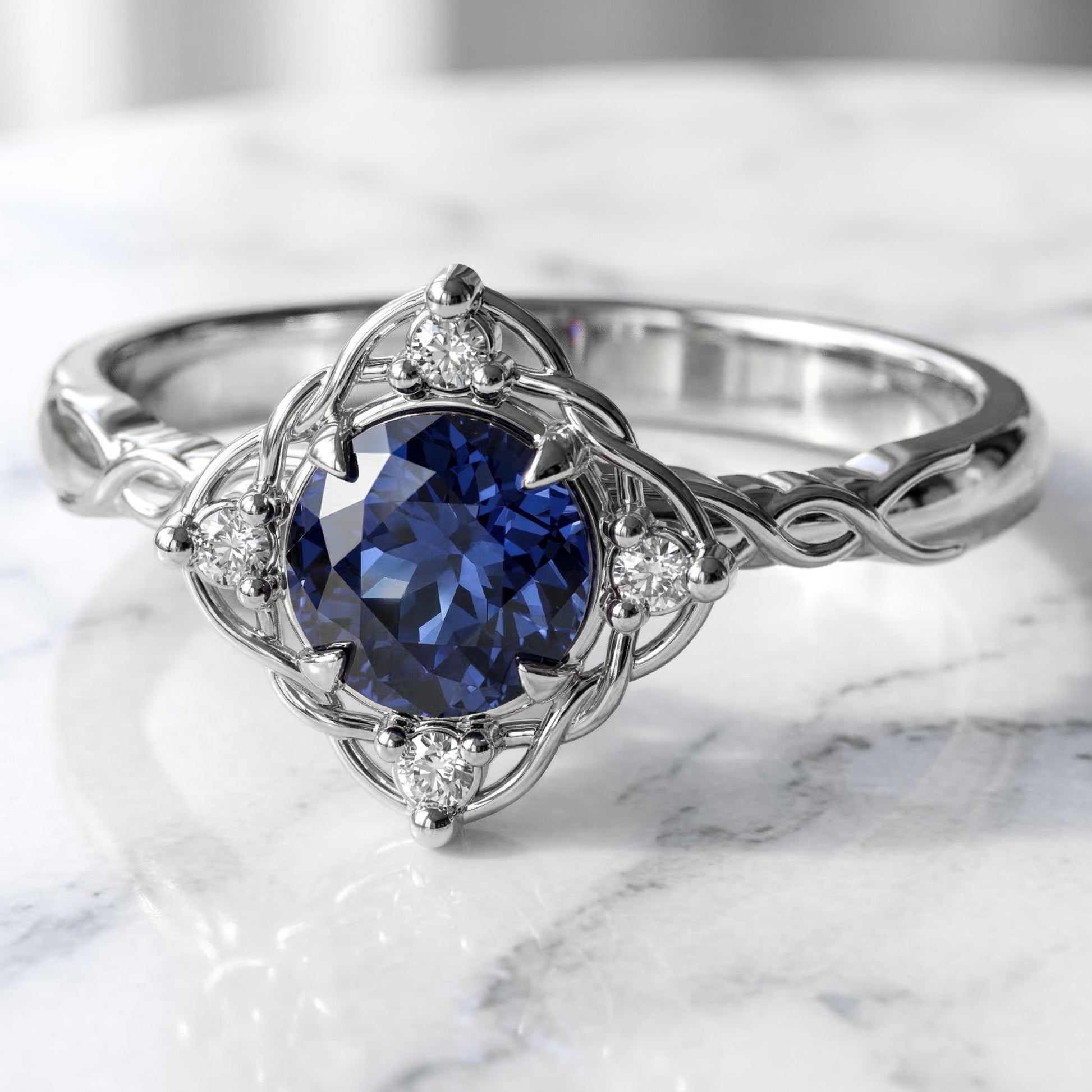 Filigree and diamond halo set medium blue sapphire in white gold settting
